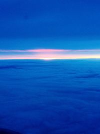 Scenic view of sea against blue sky