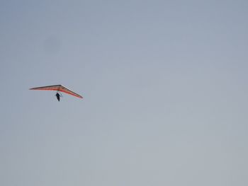 Low angle view of airplane flying in sky