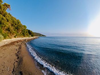 Scenic view of sea against clear blue sky