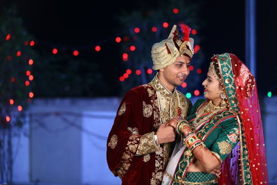 Bride and bridegroom holding hands during wedding ceremony