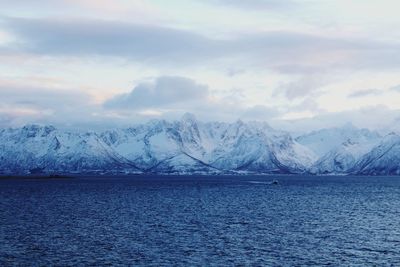 Scenic view of snowcapped mountains against sky