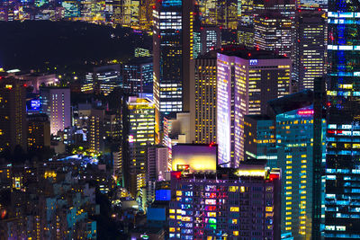 Illuminated modern buildings in city at night