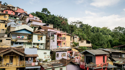 Houses in town against sky