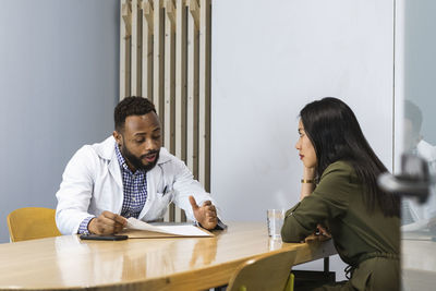 Friends sitting on table