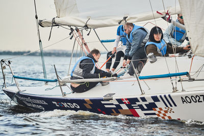 People on sailboat in sea