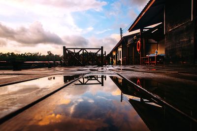 Reflection of building on water in city