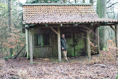 Full length of man standing by tree during autumn