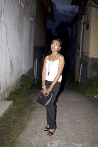 Portrait of smiling woman standing outdoors