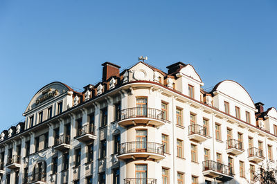 Low angle view of building against clear blue sky