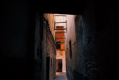 Narrow alleyway surrounded by old buildings