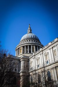 Low angle view of building against blue sky