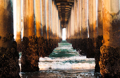 Sunrise under the huntington beach, ca pier