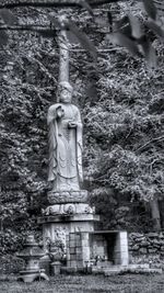 Low angle view of statue against trees