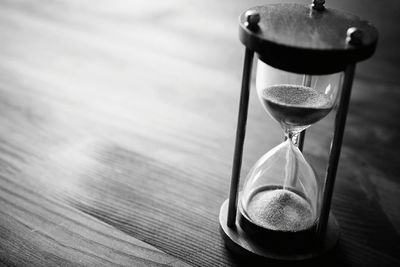 Close-up of hourglass on table