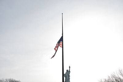 Low angle view of flag against sky