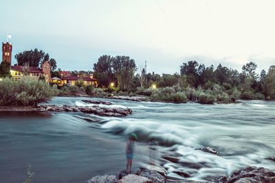 Surface level of stream against clear sky