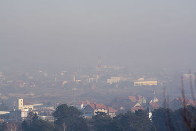 High angle view of buildings in city against sky
