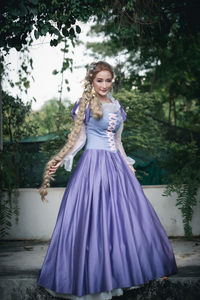 Portrait of woman standing outdoors