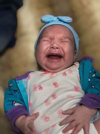 Portrait of cute baby girl with eyes closed