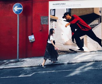 People walking on road in city