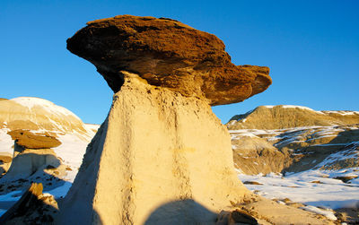 Hoodoos on snow covered field