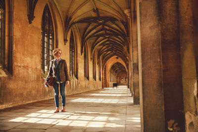 Woman walking in corridor