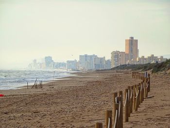 Panoramic view of sea and buildings against clear sky