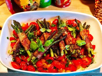 High angle view of chopped fruits in bowl on table