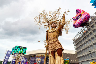 Low angle view of statue against cloudy sky