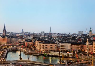 Panoramic view of river and buildings against clear sky