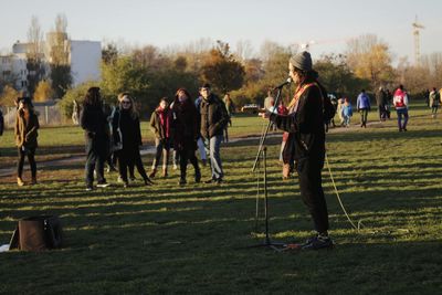 People playing soccer on field