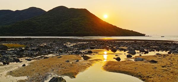 Scenic view of sea against sky during sunset