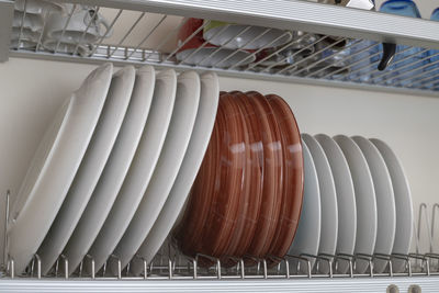 Lots of wet dishes in the dish draining closet.