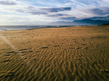Scenic view of sea against cloudy sky