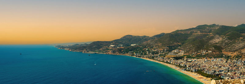 The view from alanya castle citadel in turkey during sunrise or sunset. panorama view of city.