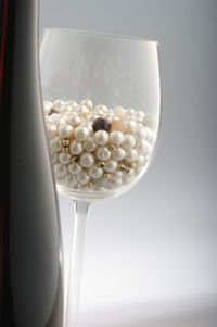 Close up of wineglass over white background