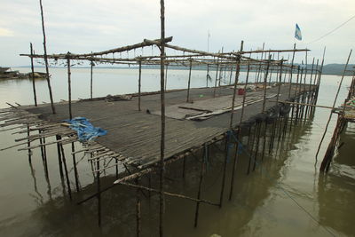 Pier over sea against sky