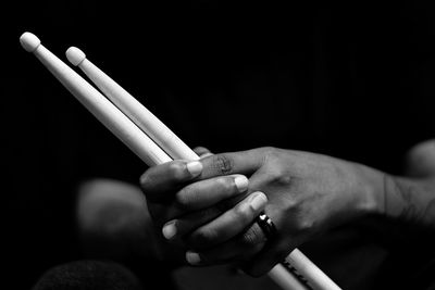 Woman holding drumsticks 