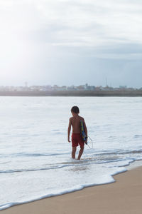 Woman standing on beach