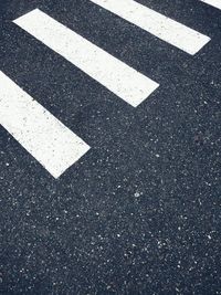 High angle view of arrow sign on road