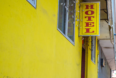 Information sign on yellow wall