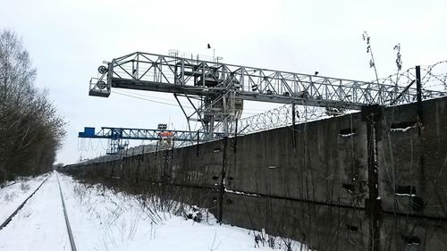 Metal bridge against sky