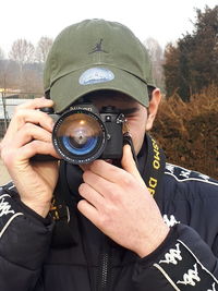 Man photographing camera