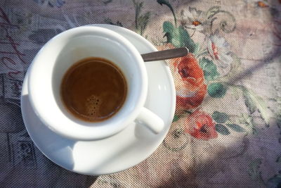 High angle view of coffee cup on table