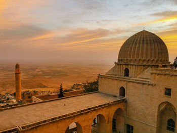 Panoramic view of cathedral and buildings against sky during sunset