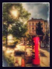 Illuminated buildings against sky at night