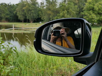 Reflection of road on side-view mirror