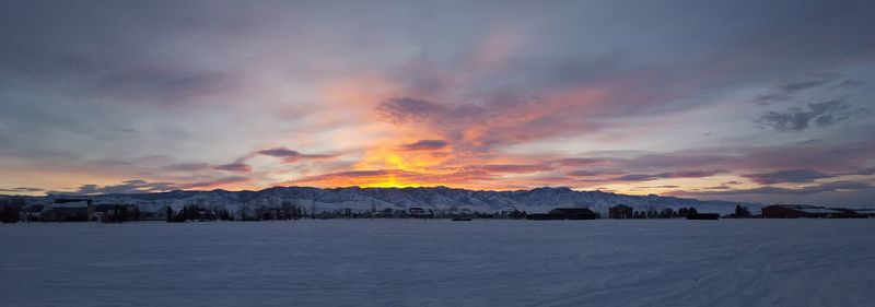 Scenic view of mountains against cloudy sky