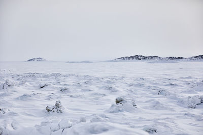 Scenic view of frozen sea against clear sky