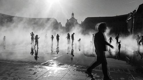 People enjoying at miroir deau